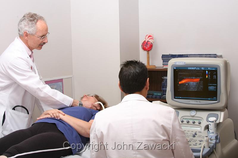 IMG_6204 copy.jpg - Dr. Weinstein assisting or observing a cardiovascular test on a patient